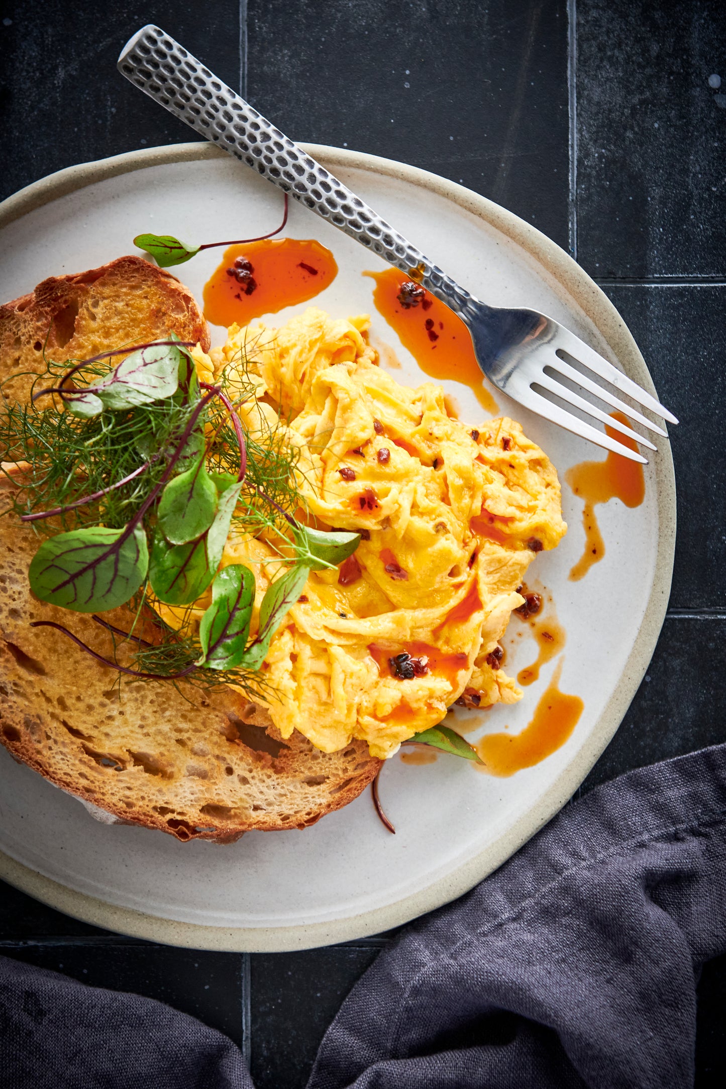 omelette on toast with killer condiments crispy chilli oil