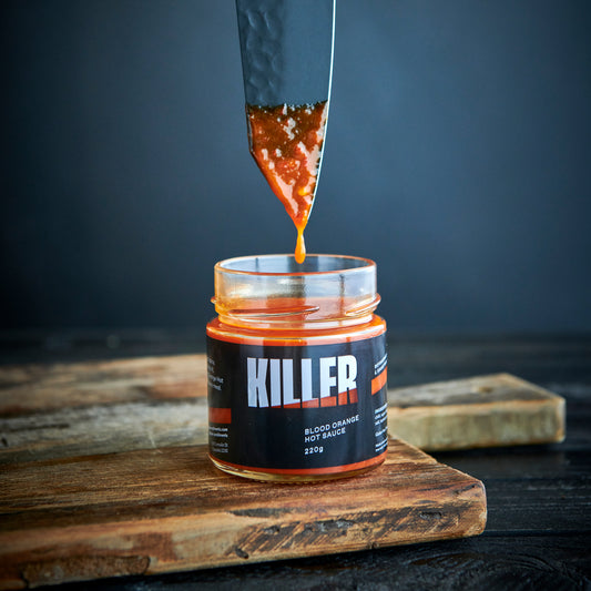 killer condiments blood orange hot sauce jar